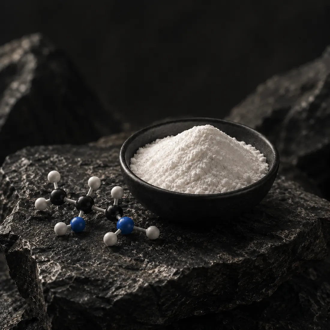 L-Arginine powder with molecular model on dark stone